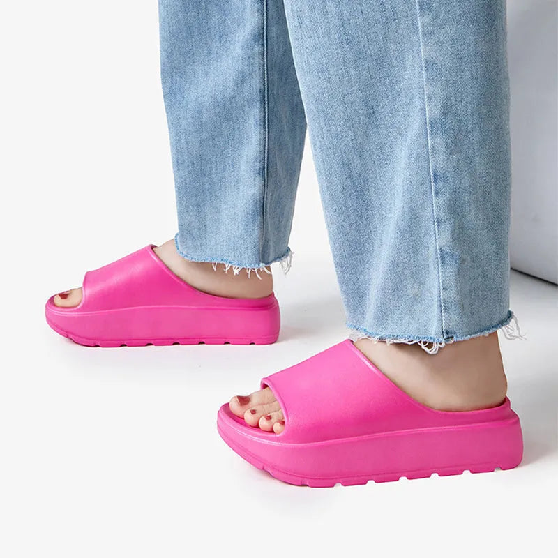 Women's beige thick-soled EVA slippers with a 5.5cm platform, shown from the side.