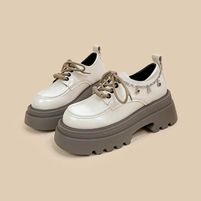 White platform Mary Jane leather shoes with chunky heel and lace-up closure
