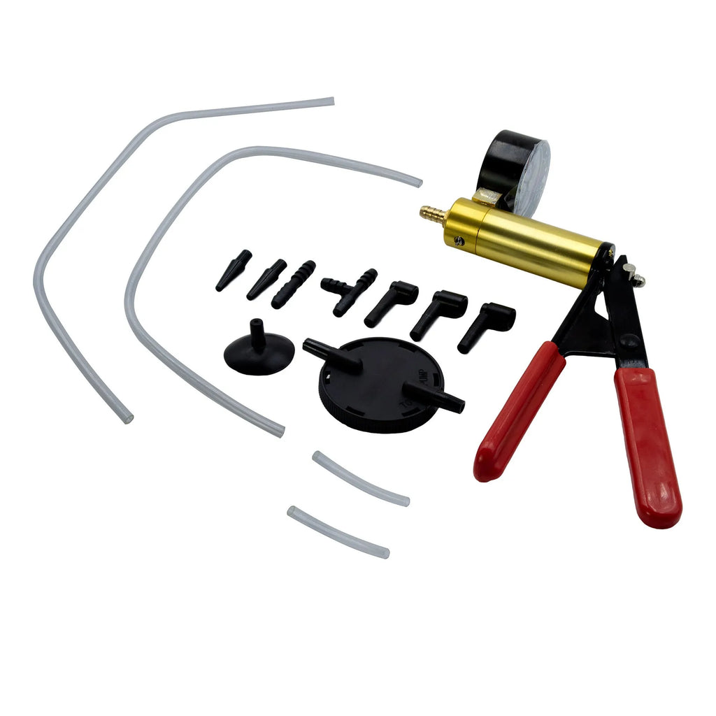 Manual aluminium vacuum air blow gun car dent repair tool on a workshop bench.