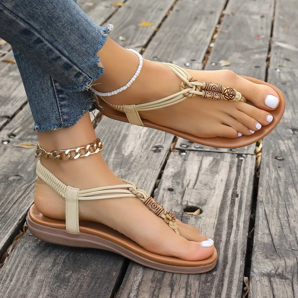 New women's flat sandals in beige with PU upper and hollow design
