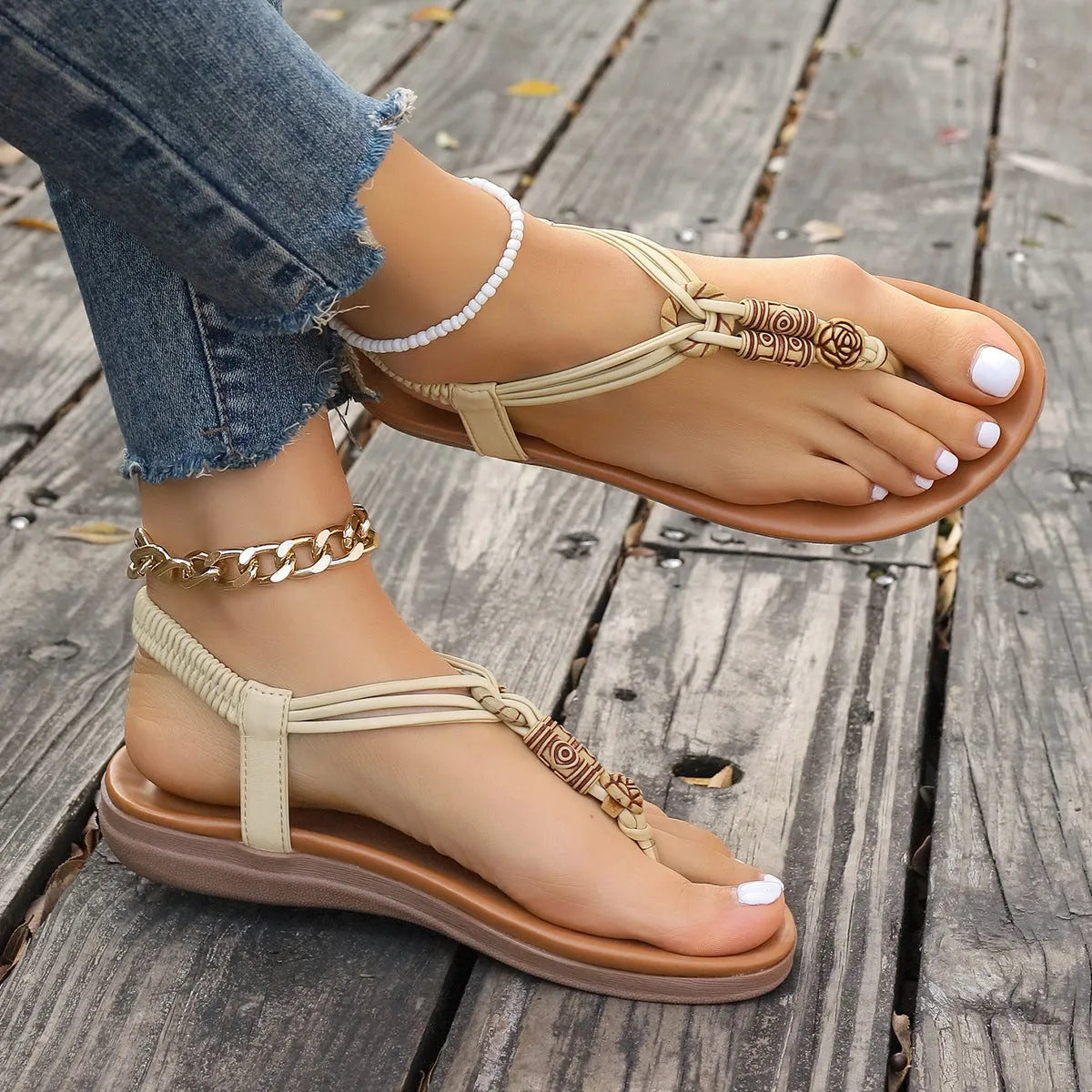 New women's flat sandals in beige with PU upper and hollow design