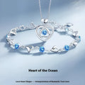 Blue electroplated heart pendant necklace and matching bracelet set with geometric design and gem inlaid detail
