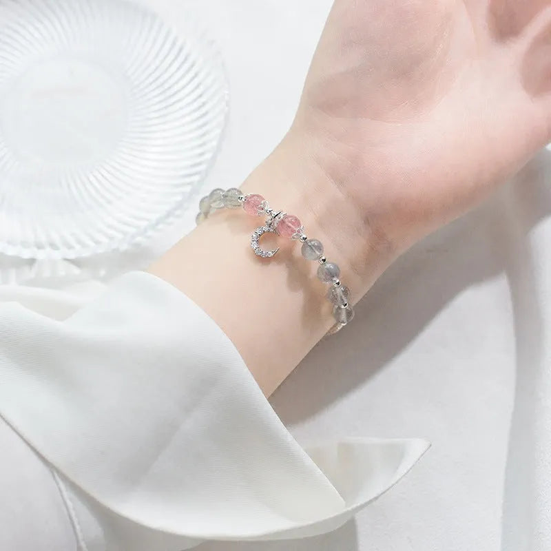 Handmade adjustable bracelet with a natural moonstone centre on a silver-toned chain.