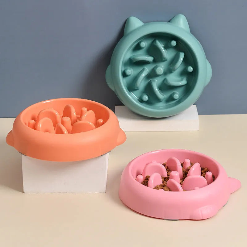 Green bone-shaped slow feeder dog bowl with internal ridges for anti-gulping feeding.