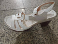 Women's peep toe wedge platform sandals in light brown with an adjustable buckle strap.