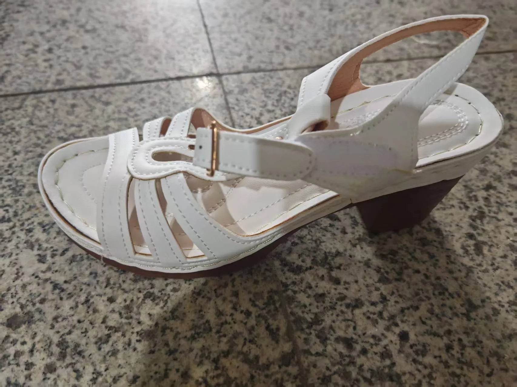 Women's peep toe wedge platform sandals in light brown with an adjustable buckle strap.