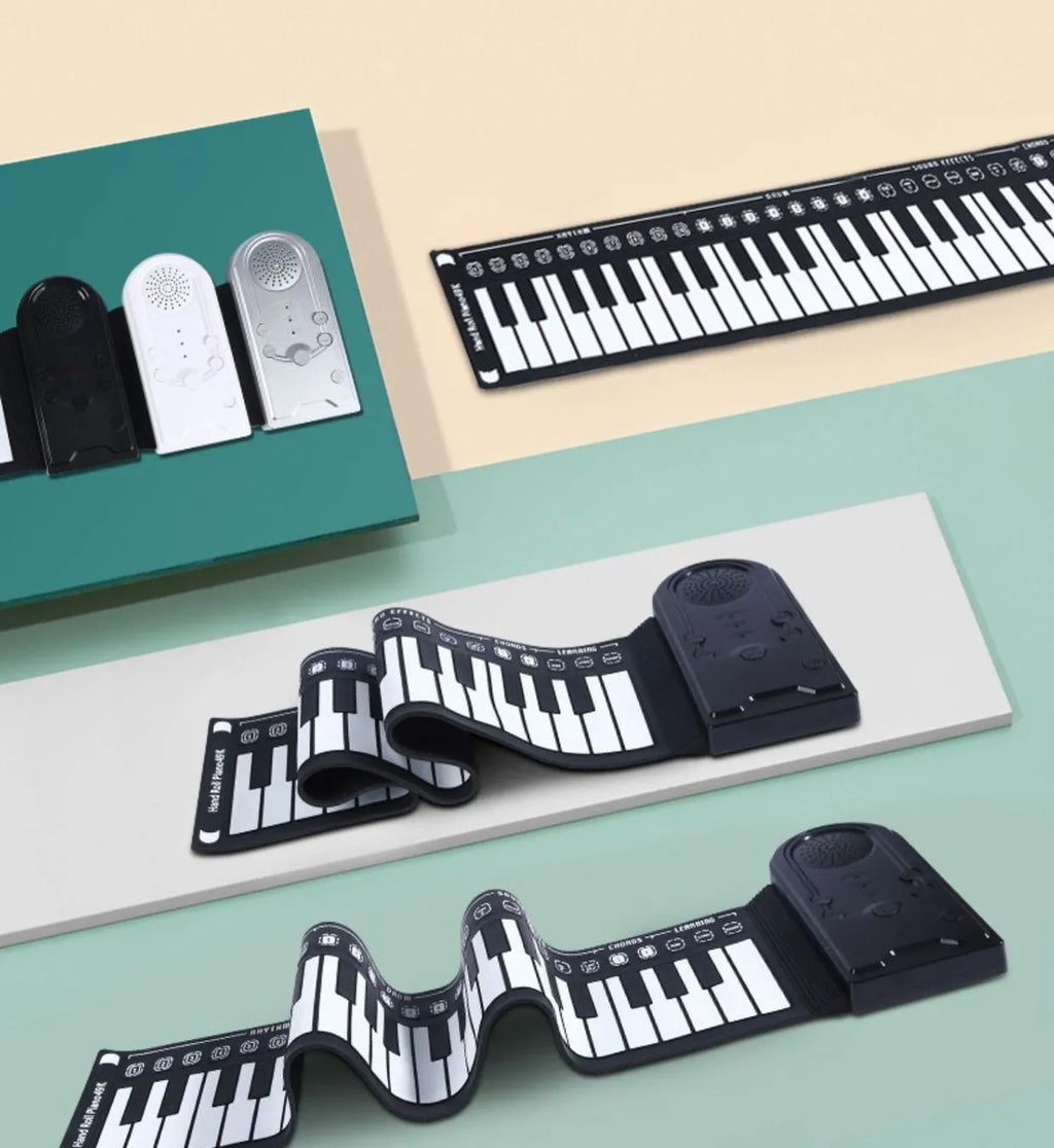Folding electronic keyboard with 49 silicone keys, shown in gloss black, folded to compact size with speaker visible on control panel