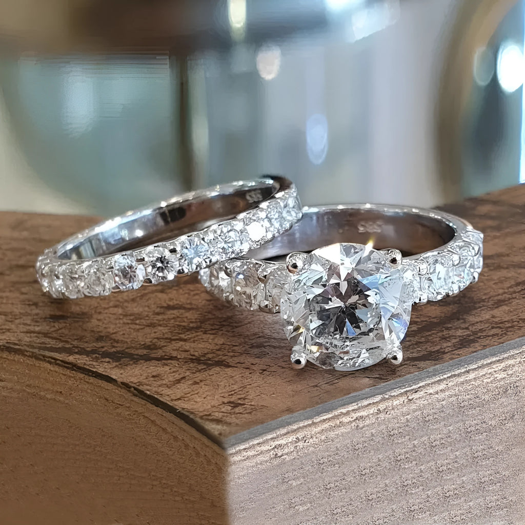Two matching copper couple rings with a white gold finish and a small zircon stone inlay on a white background