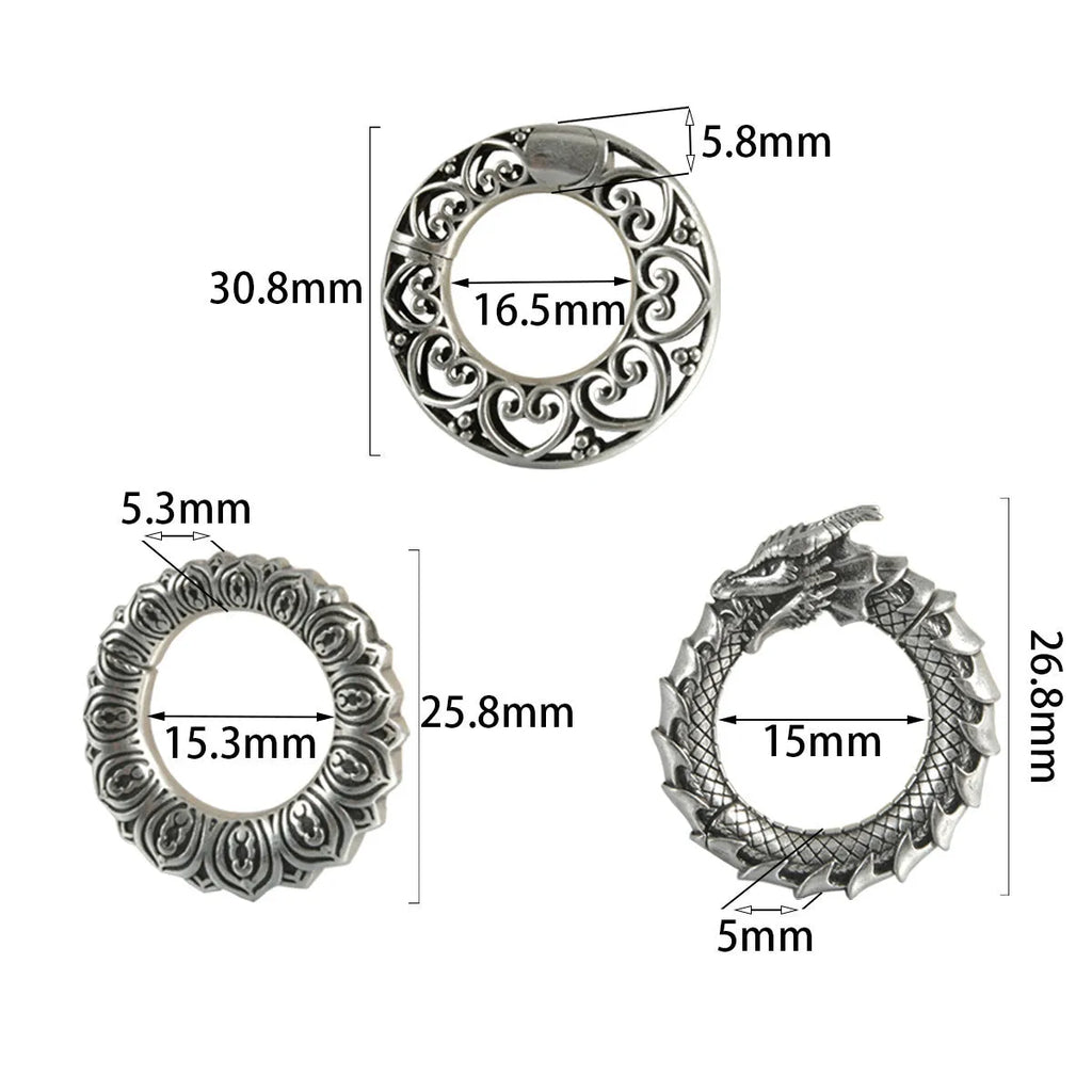 Large geometric dragon earrings with antique silver finish and hollow-out design on white background