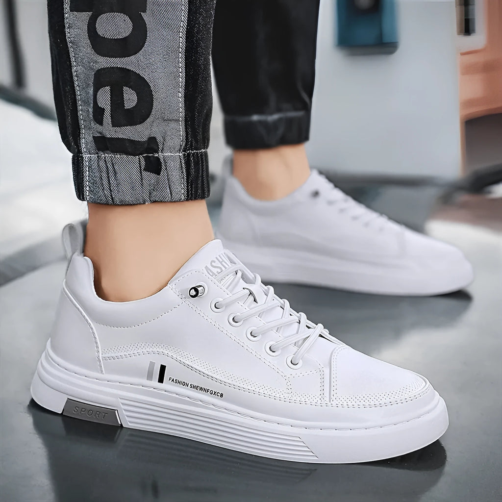 Men's low-top skate shoes with elastic band, microfiber upper, and round toe in black and white.