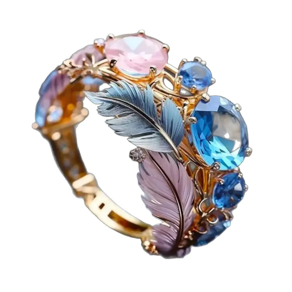 Gold brass feather ring with embossed colourful geometric design and zircon details