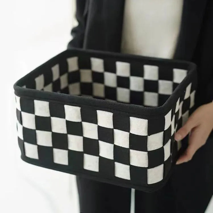 Checkerboard pattern woven felt folding storage basket shown with dimensions 37cm by 29cm by 19.5cm