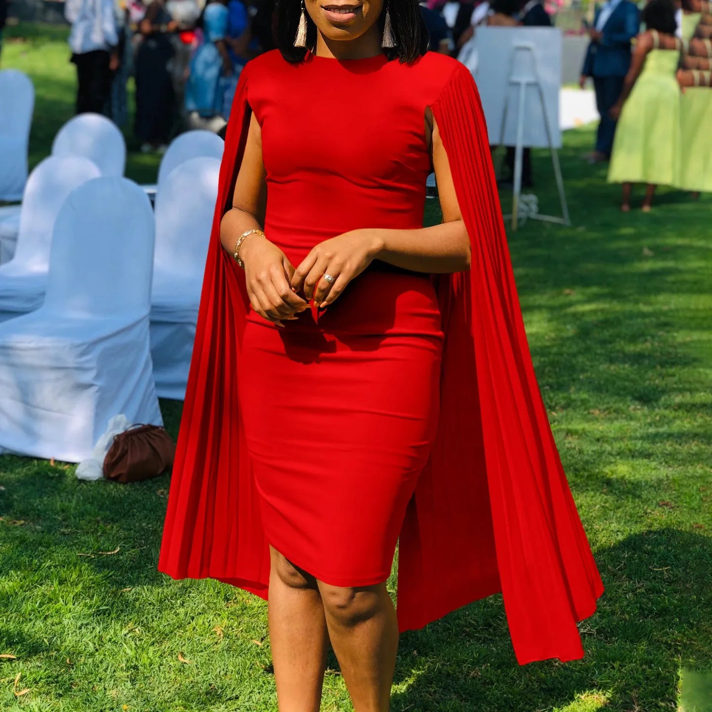 Round neck evening gown with pleated shawl collar and long sleeves in polyester fabric