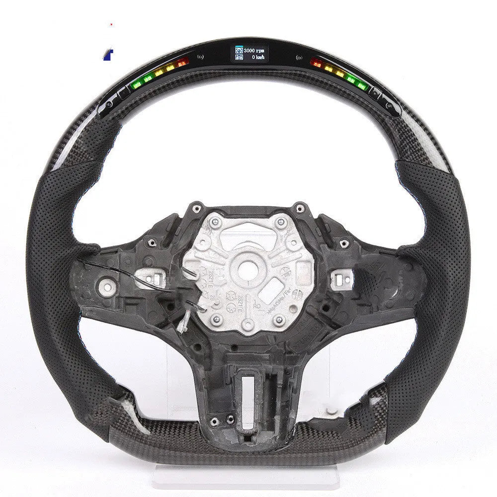 Black carbon fibre BMW sports steering wheel with LED display and multifunctional buttons.