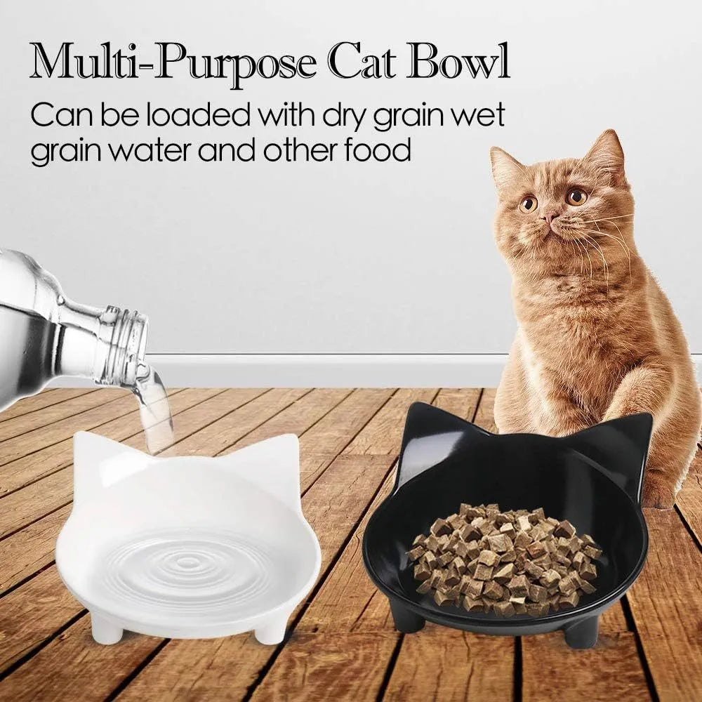 Shallow black melamine cat bowl with non-slip rubber base on a wooden floor.