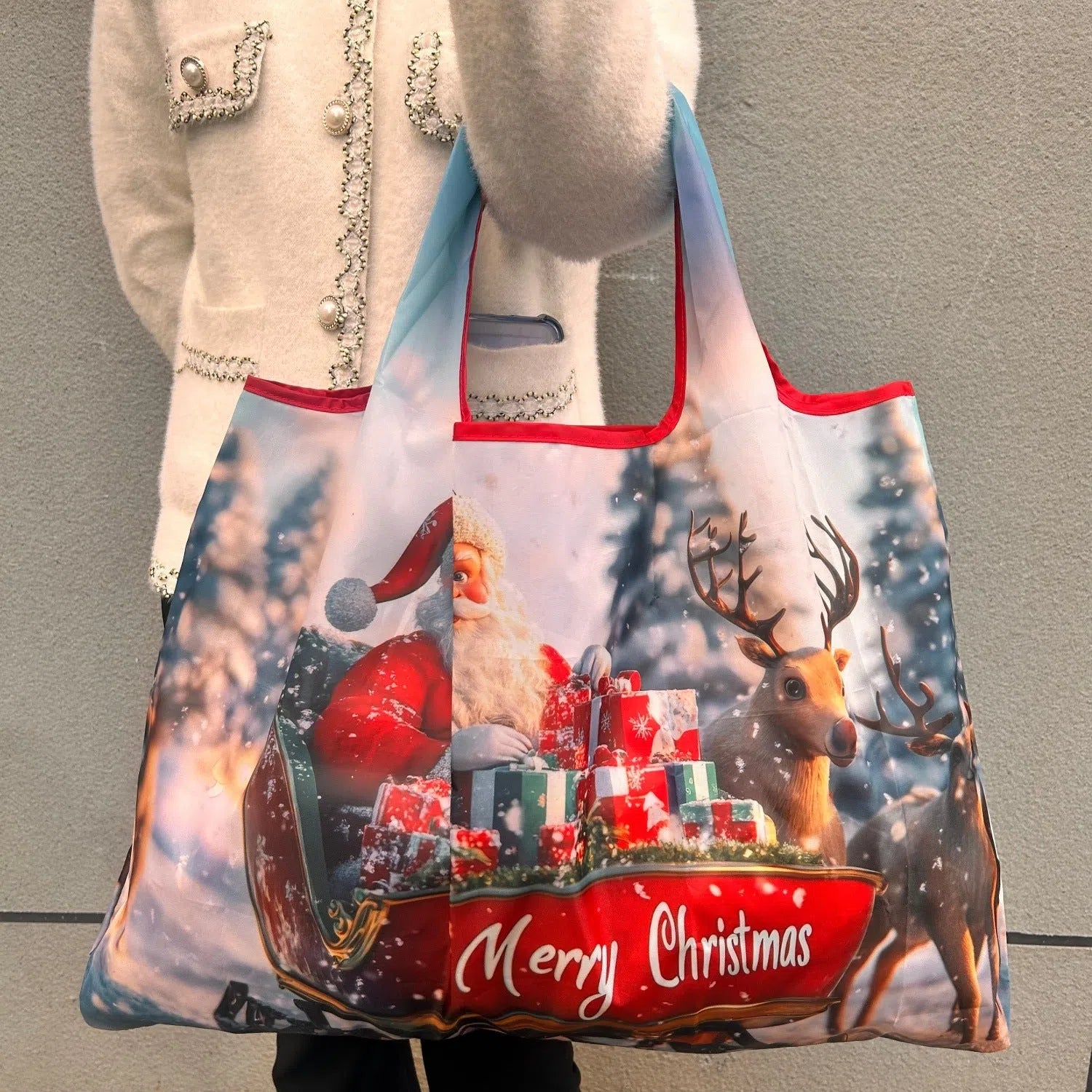 One-shoulder Santa Claus gift bag in red with festive design, large polyester bag with Santa pattern
