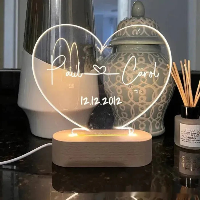 Personalised acrylic night light with engraved names and date, measuring 20cm by 11.5cm