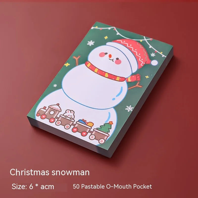 Christmas cartoon sticky notes pad showing eight festive designs including Santa Claus, snowman, and Christmas elf