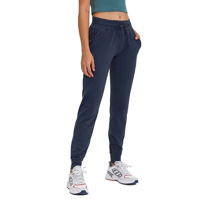 Women's high waist yoga pants with drawstring waistband in distilled coffee colour.