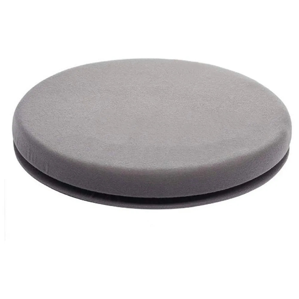 A grey rotating car seat cushion with a non-slip base, shown on a car seat.