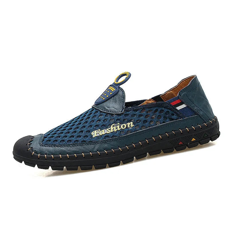 Men's brown casual shoes with mesh fabric upper and rubber sole, showing round toe and shallow-cut design.