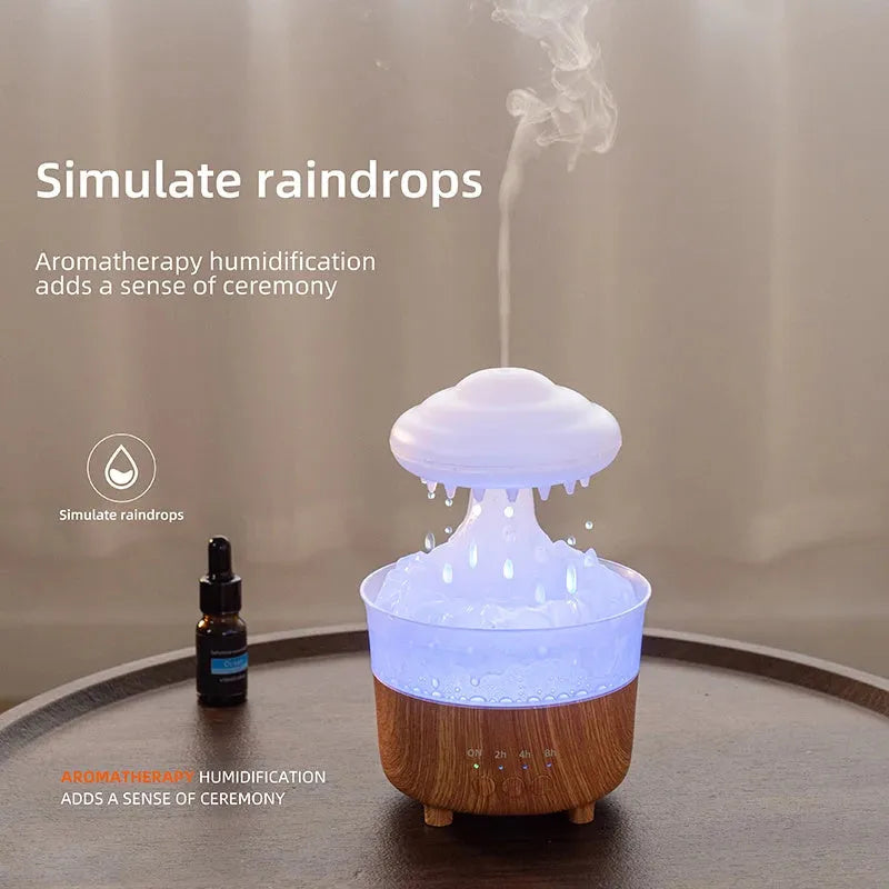 Wood grain white rain cloud shaped humidifier diffuser with LED night light on a table.