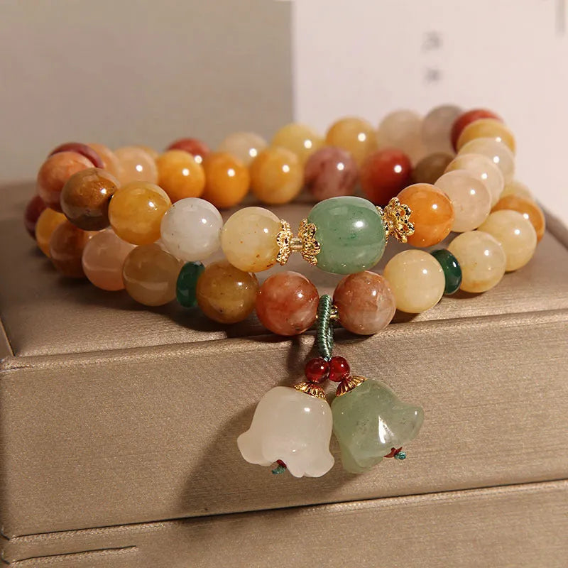 Women's natural jade multi-layer bracelet with orchid pendant on wrist