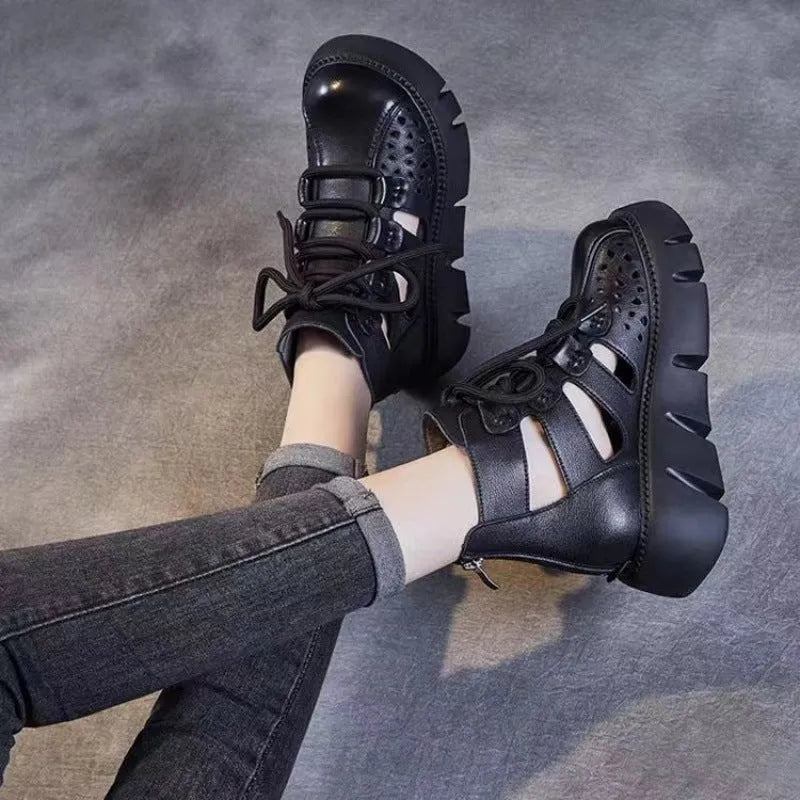 Women's black platform sandals with fish mouth toe and plush leather upper on a neutral background.