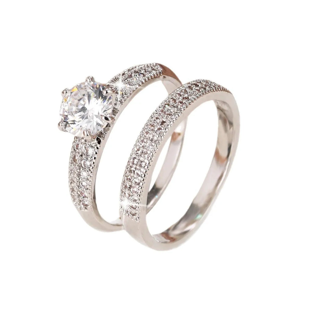 Copper hollow geometric ring with electroplated zircon finish showing structured angles