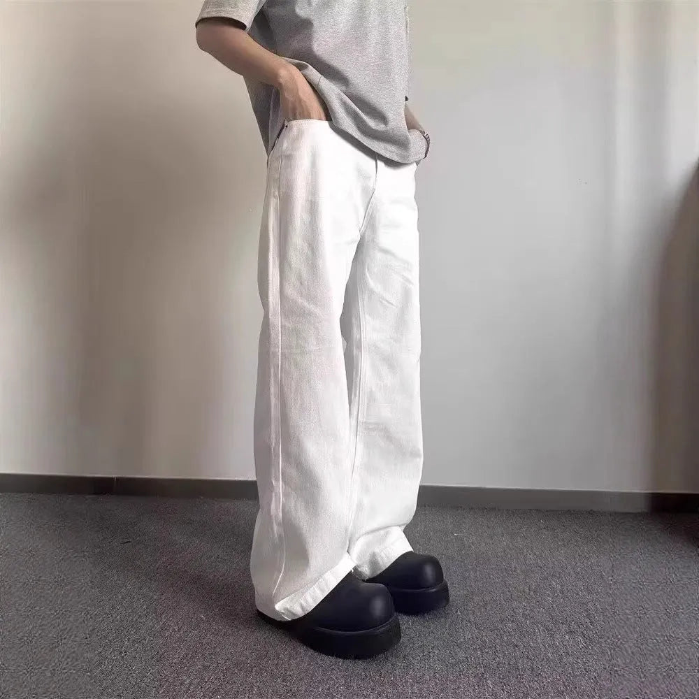 Men's high-grade white loose straight leg denim jeans on a mid-waist.