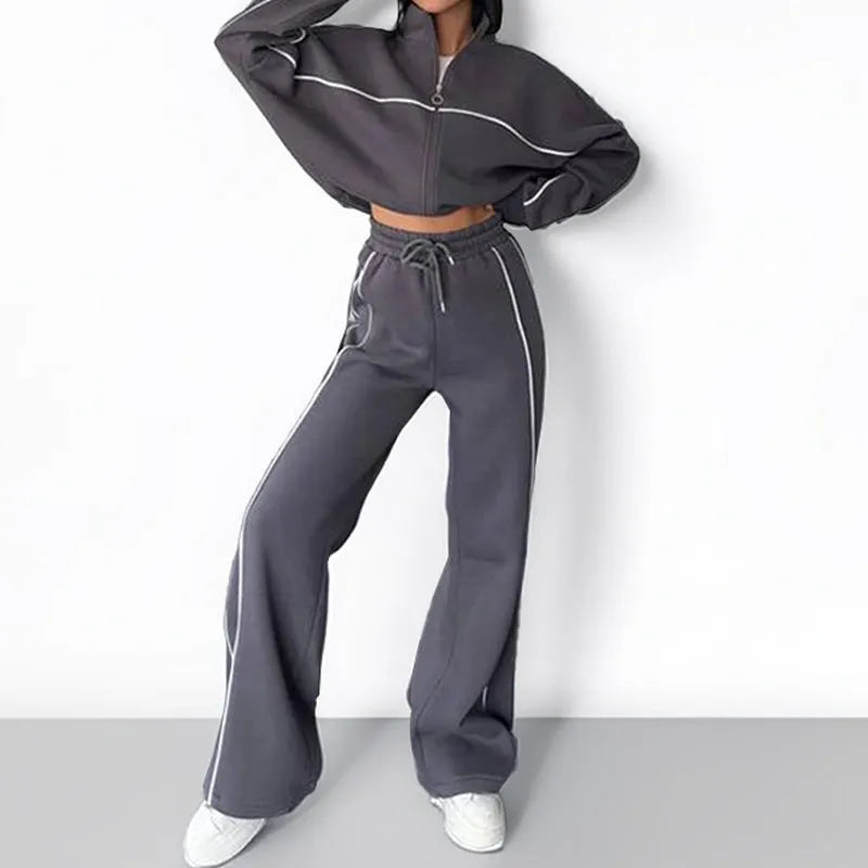 Casual striped suit set comprising a long sleeve mock neck hoodie and matching lace-up trousers.