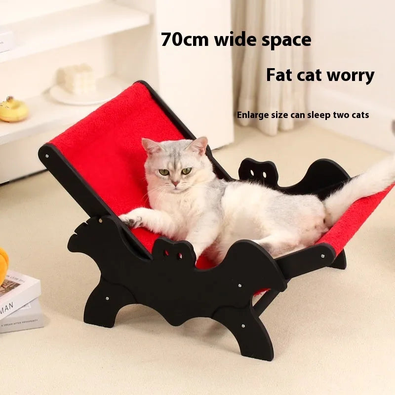 Black and red wooden cat lounge chair with bat-shaped decorative elements for Halloween themes