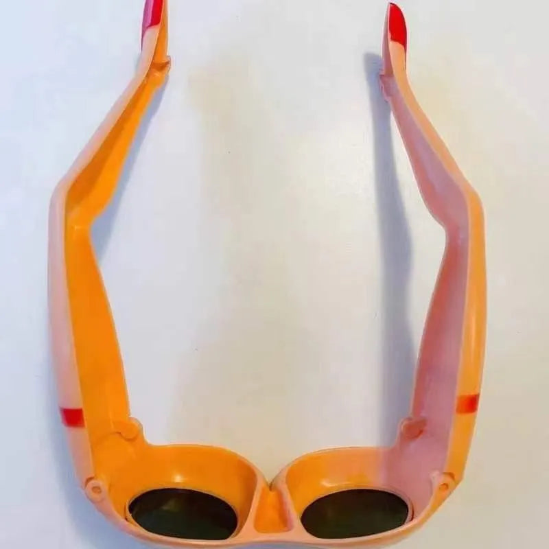 Orange novelty sunglasses with a personality leg and hip design on the plastic frame.