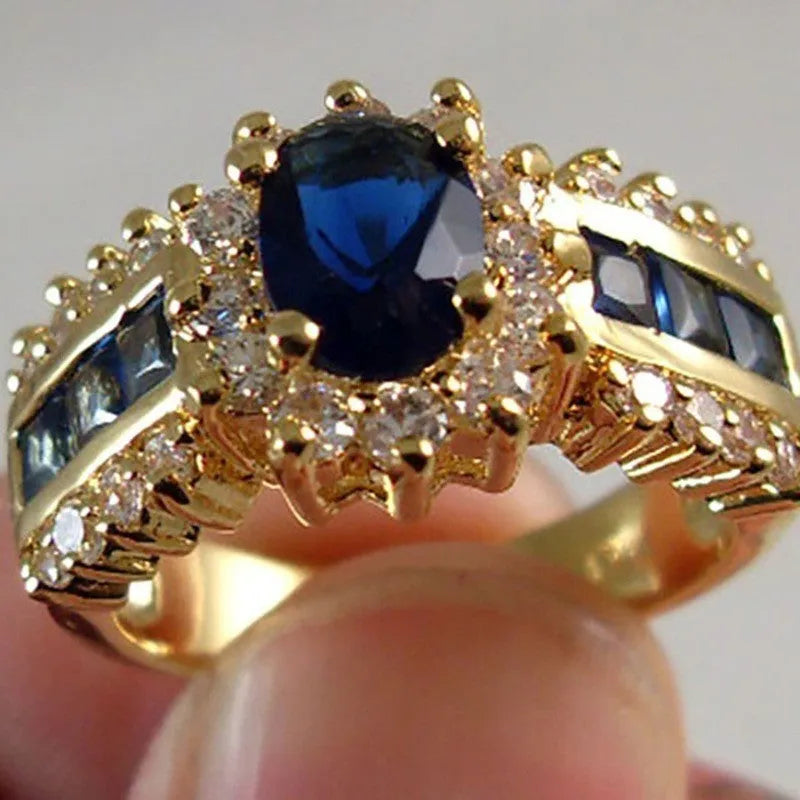 Personalised zinc alloy fashion ring with diamond or blue and purple zircon stone detailing.