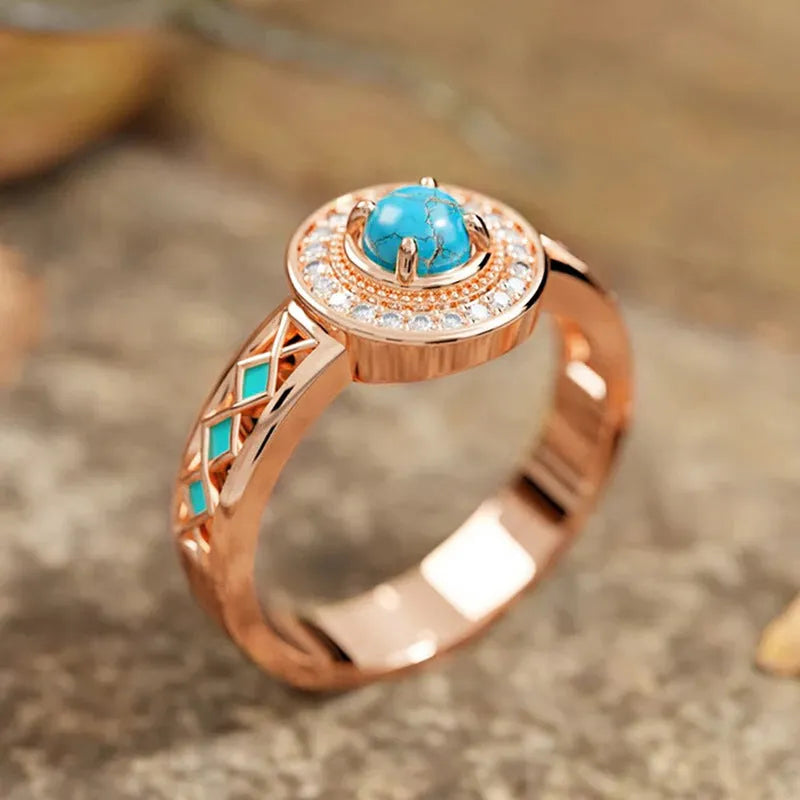 Women's turquoise geometric ring with micro-inlaid zircon on rose gold copper band.