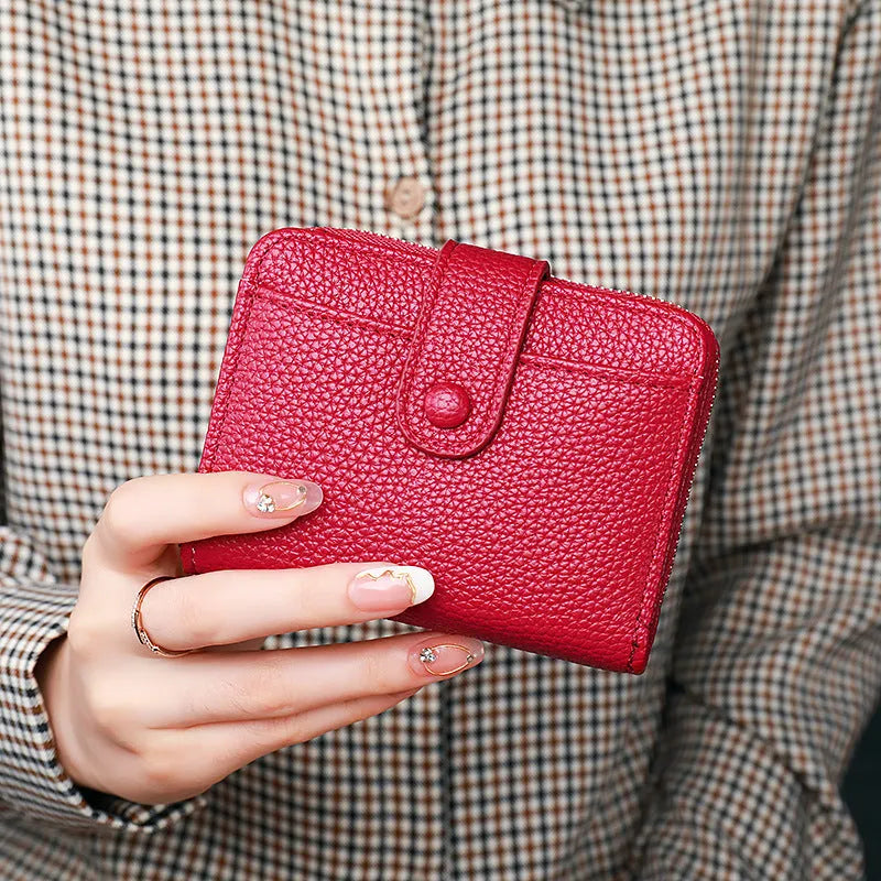 Women's lychee pattern organ short wallet in pu leather available in beige pink black and red colours