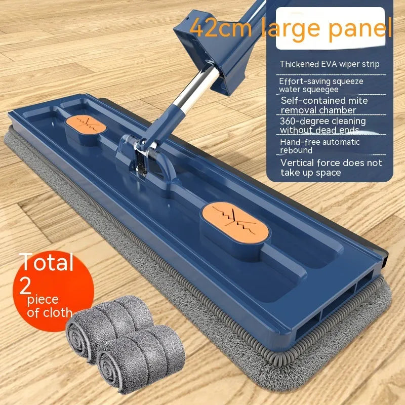 Large blue flat mop with long stainless steel handle and rotating head shown on hard floor