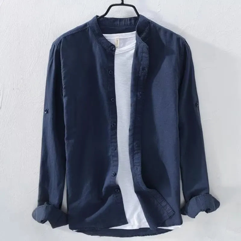 Man wearing a loose-fit light blue casual long sleeve shirt made from cotton linen fabric.