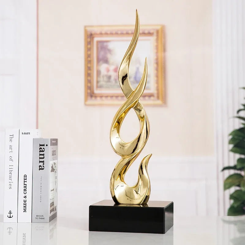 Resin decorative ornament in gold colour with modern minimalist design for festival decoration