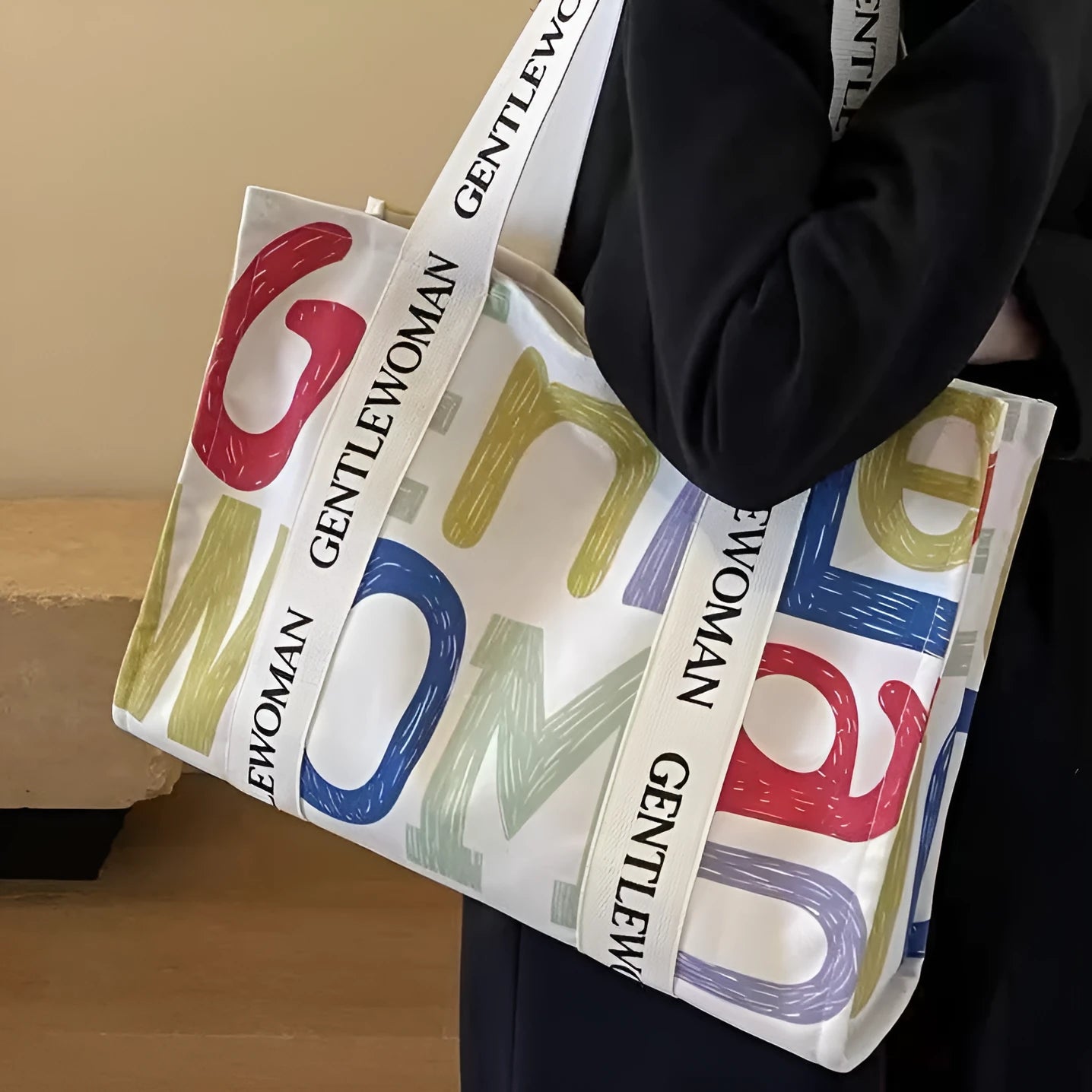 Women's large capacity canvas tote bag with printed design in three colour options.
