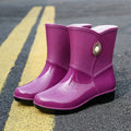 Women's purple PVC fashion rain boots with non-slip sole and low tube socks design