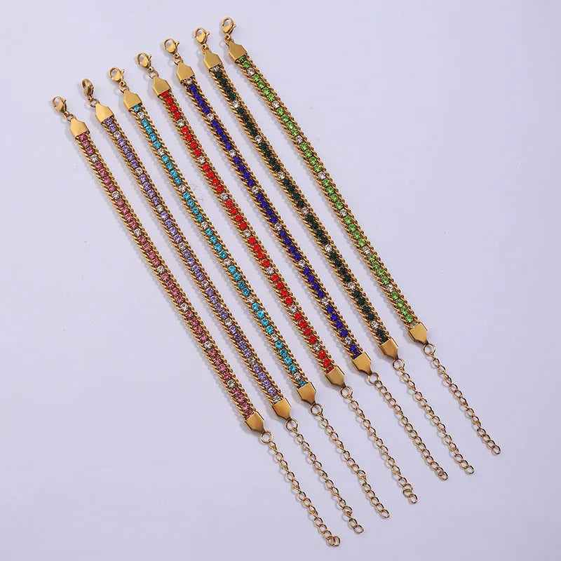 Three-layer gold electroplated stainless steel chain bracelet on women's wrist with geometric links