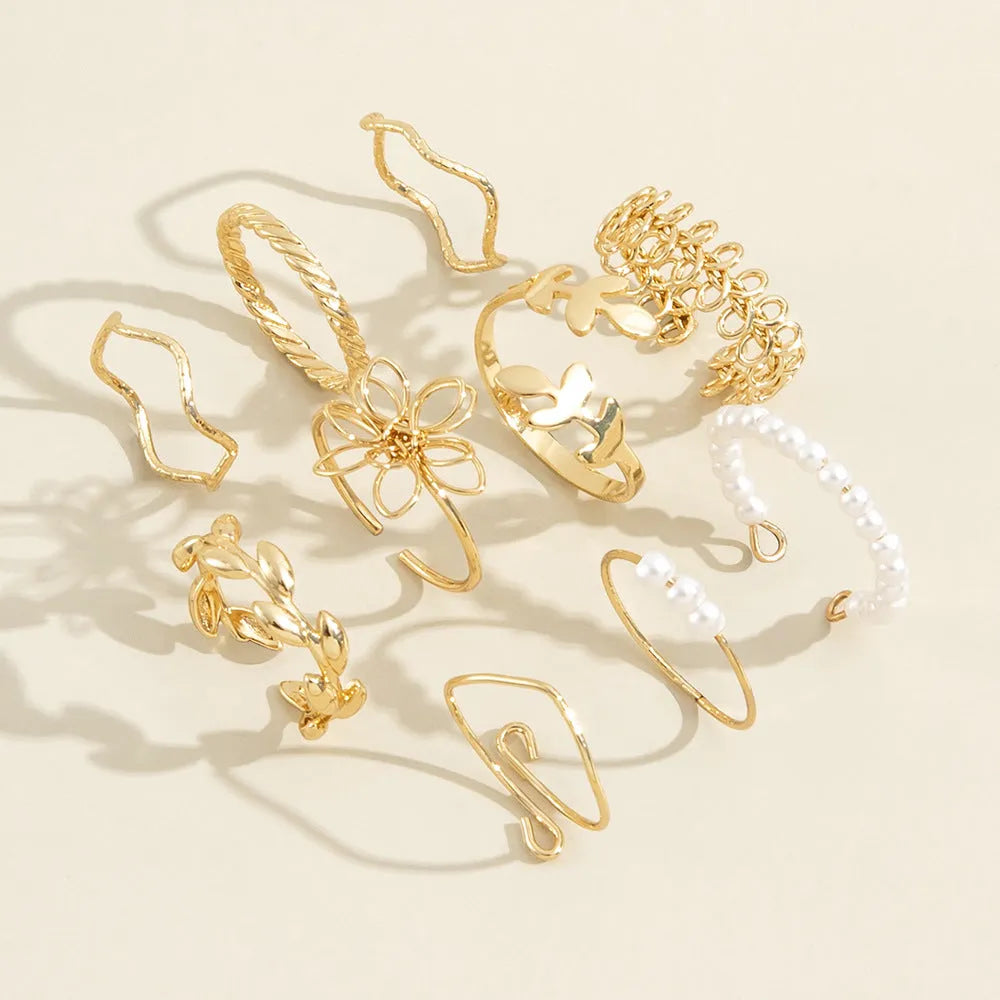 Gold tone openwork flower design alloy ring for women with glossy electroplated finish