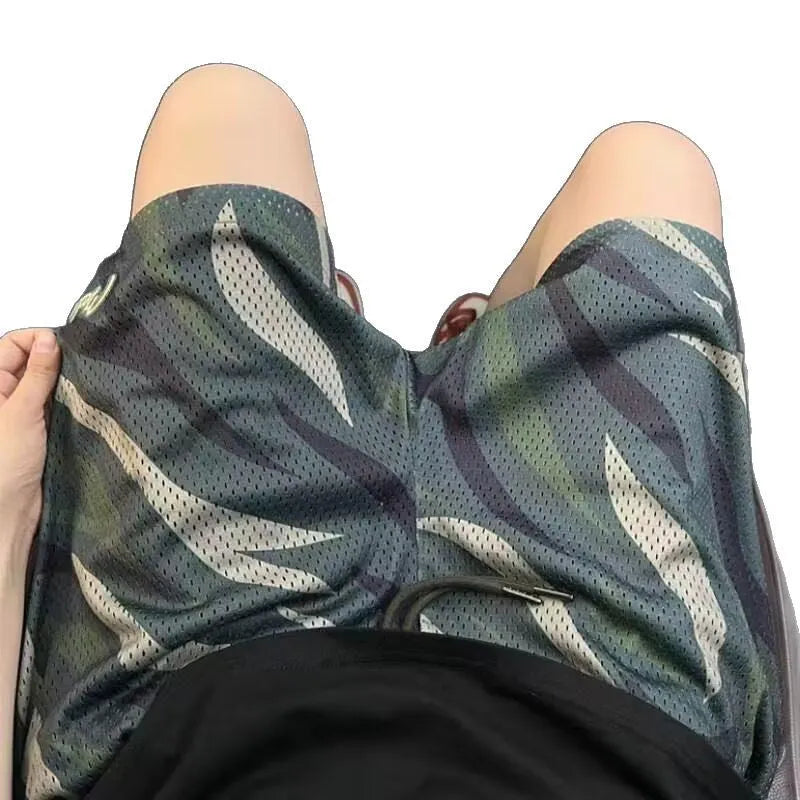 Men's straight-leg camouflage shorts in a cotton blend fabric, laid flat.