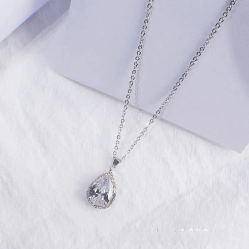 Women's geometric drop shape alloy necklace with rhinestone accents in rose gold pink colour