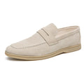 Men's beige leather slip-on casual shoes with a round toe and rubber sole on a white background