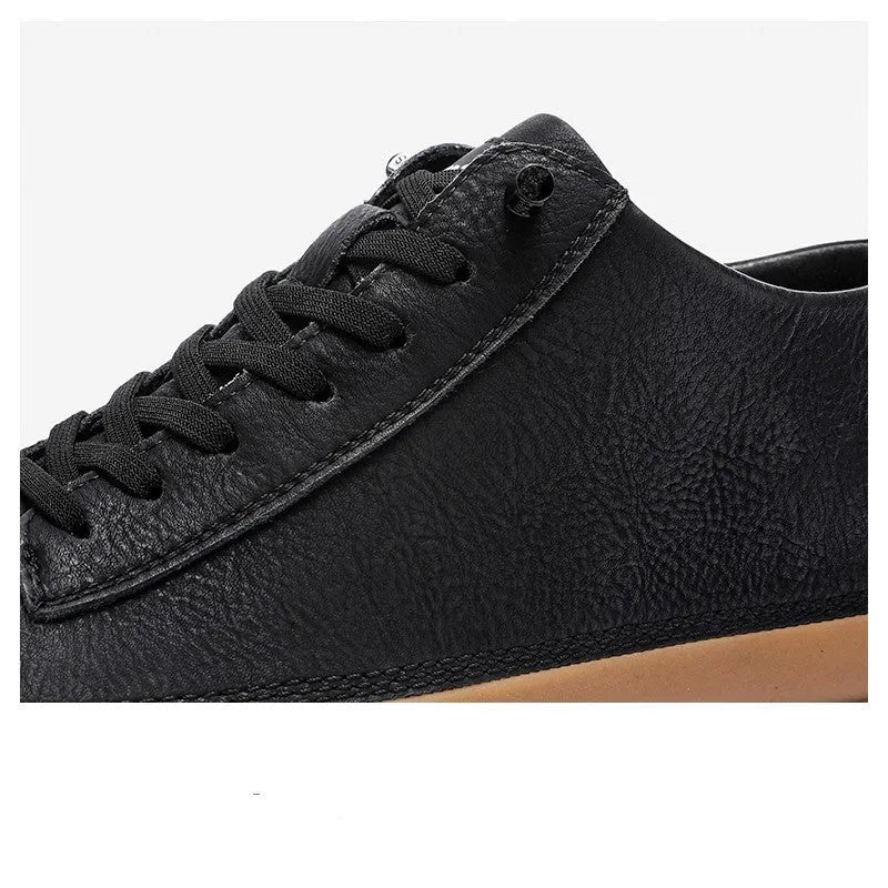 Men's black leather casual shoes with round toe and lanyard closure on white background
