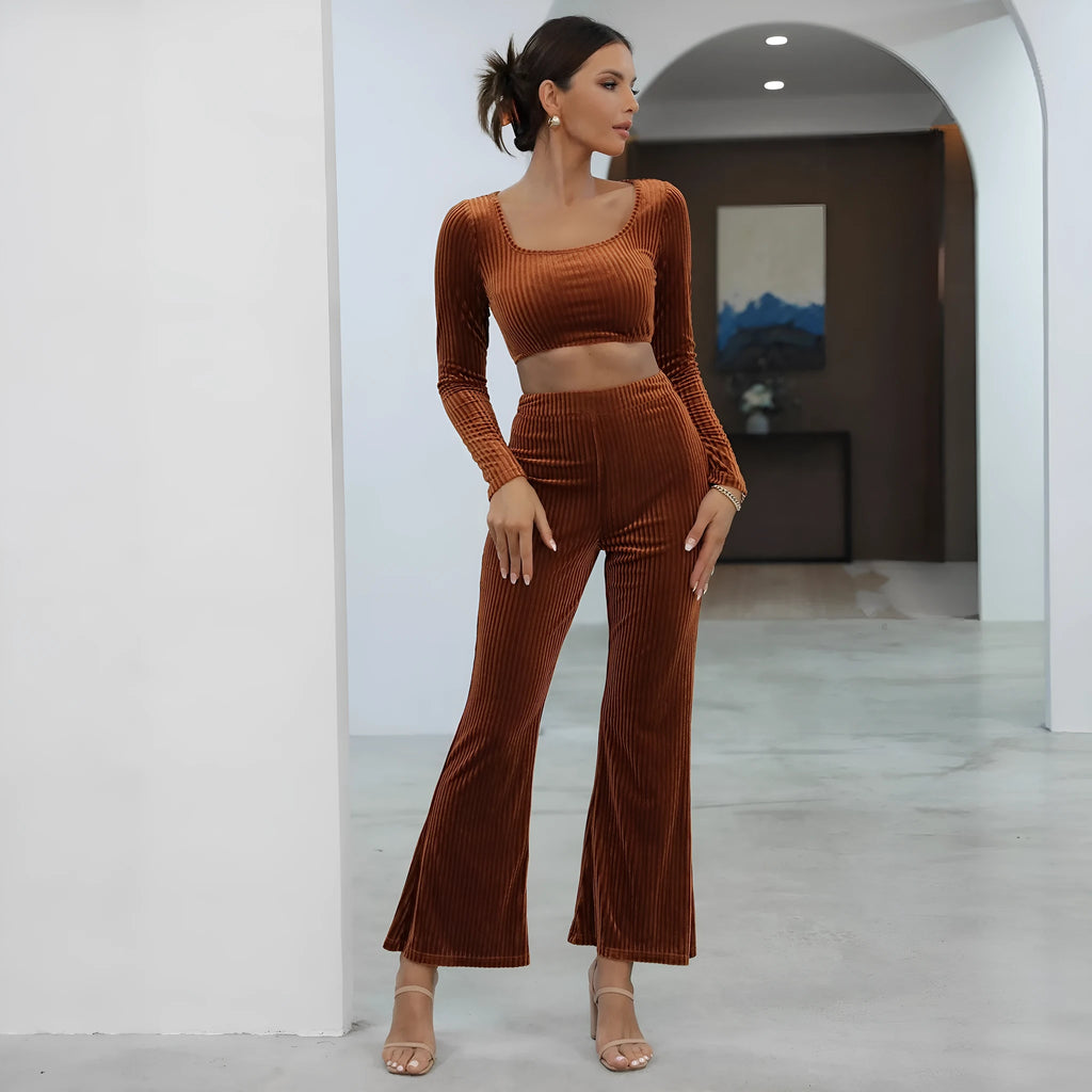 Caramel coloured women's long sleeve sweater and trouser casual set on a hanger.