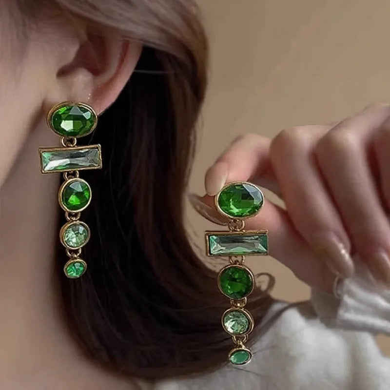 A pair of green gradient geometric drop earrings with alloy tassels and an inlaid zircon stone.