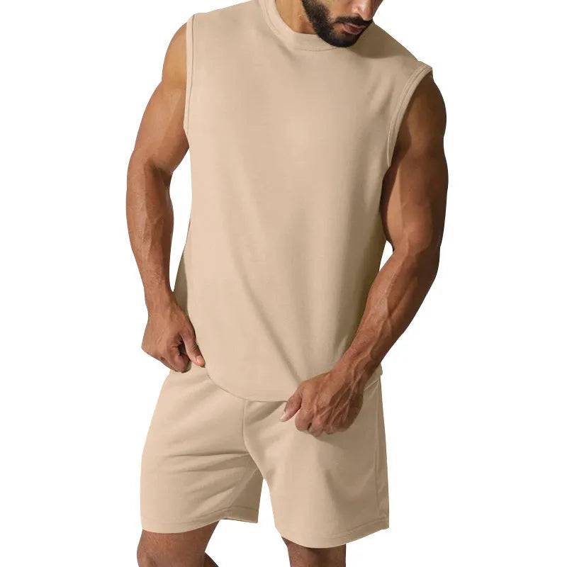 Men's sleeveless cotton blend sports suit with matching shorts in a solid colour.